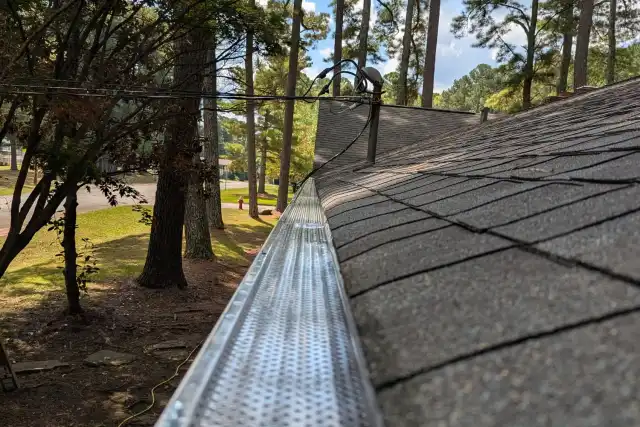 Newly installed seamless aluminum gutters on a North Alabama home